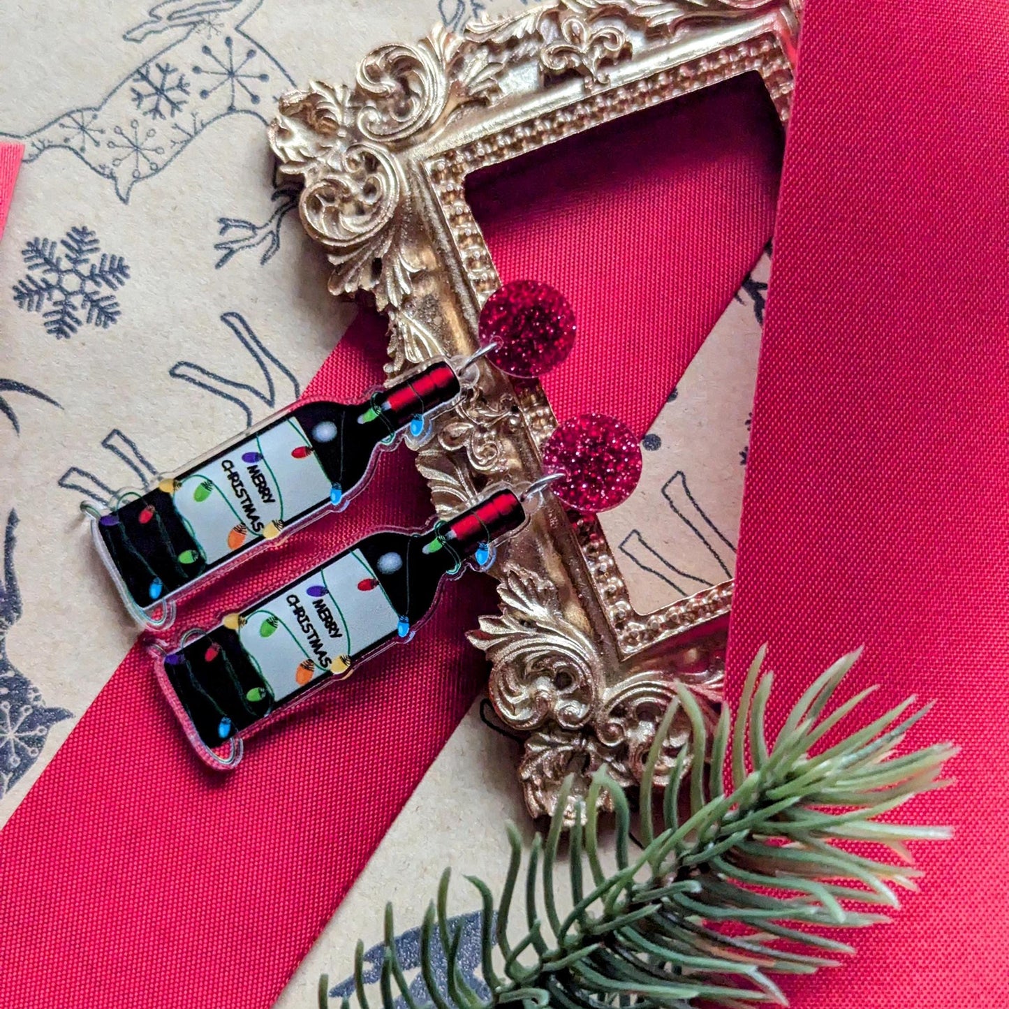 Boucles d'oreilles de Noël amusantes avec une bouteille de vin