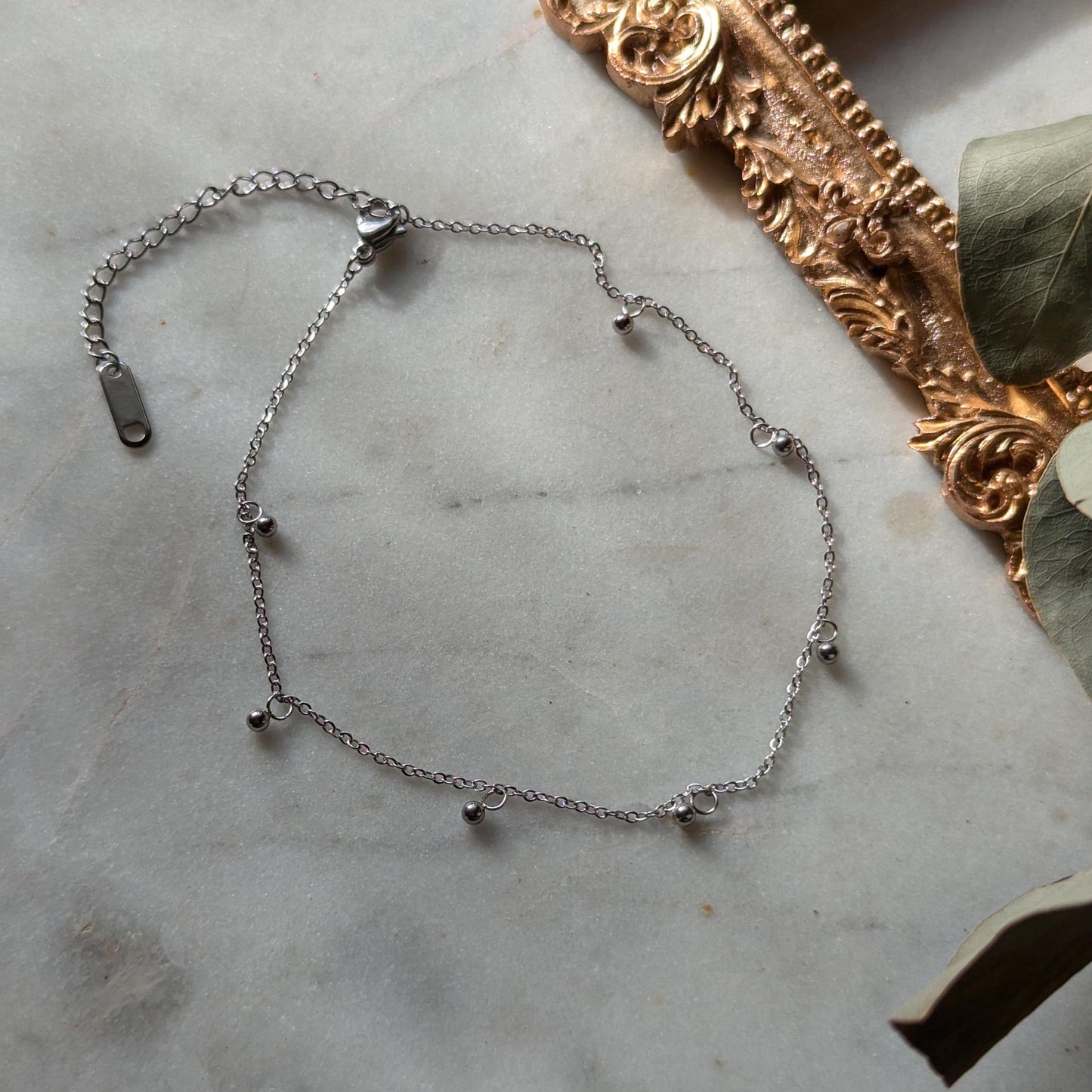 Bracelet de cheville en acier inoxydable avec petits pendentifs