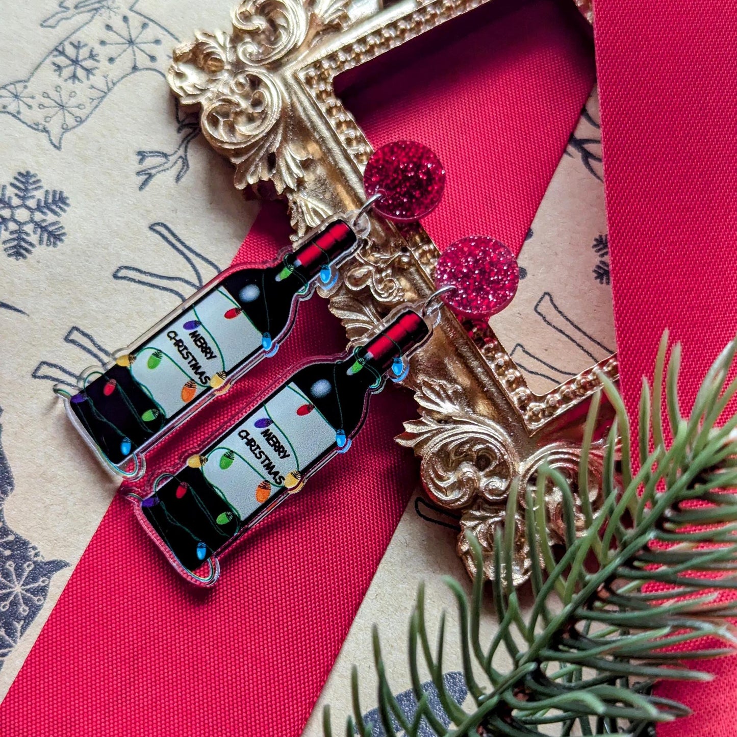 Boucles d'oreilles de Noël amusantes avec une bouteille de vin