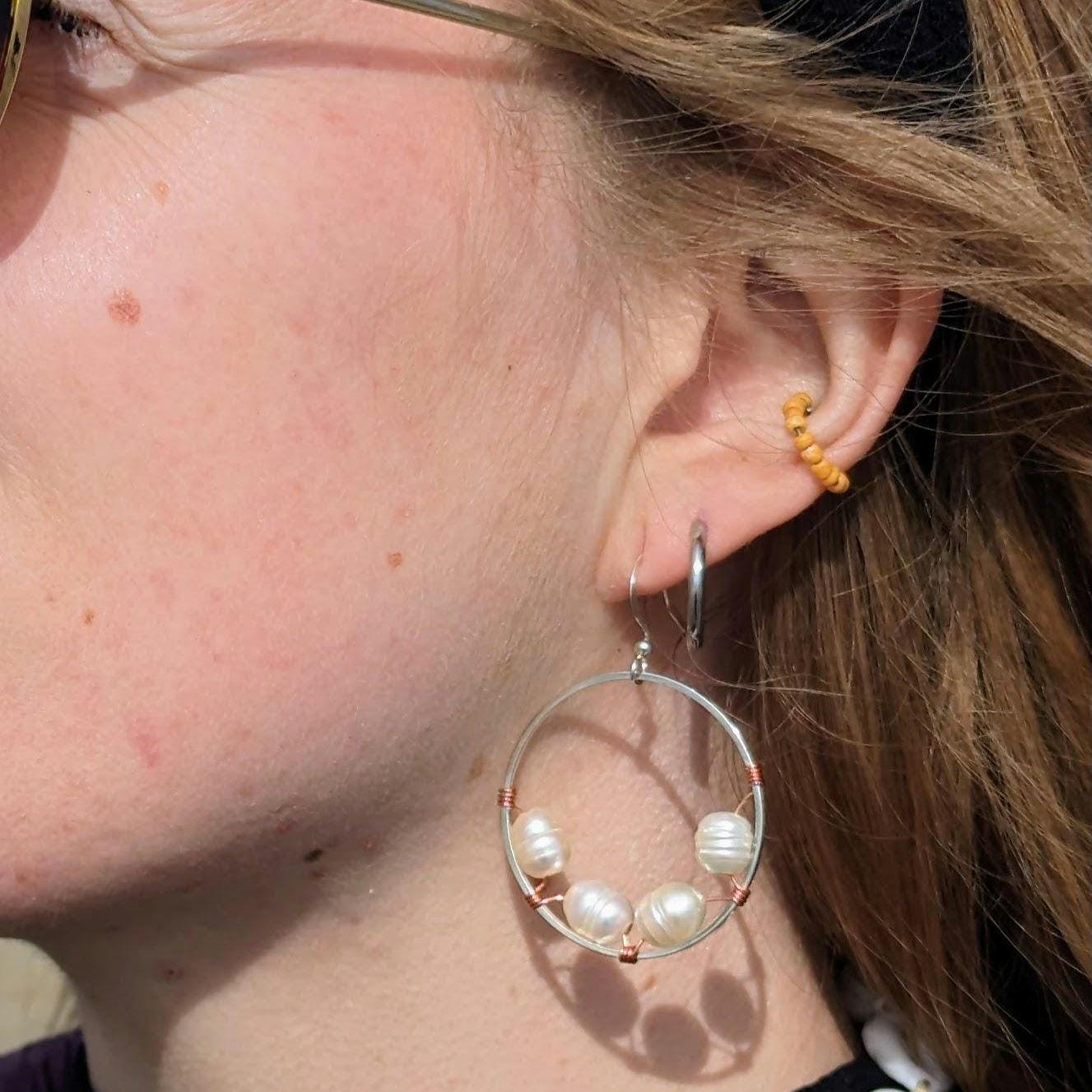 Wrapped pearl earrings with bi-metal detail
