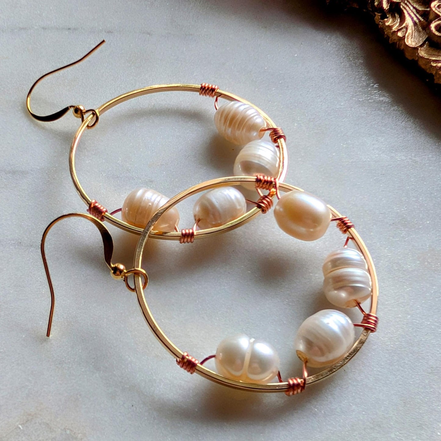 Wrapped pearl earrings with bi-metal detail