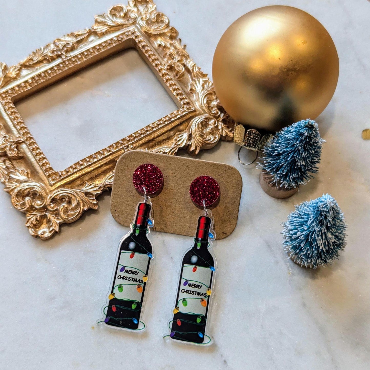 Boucles d'oreilles de Noël amusantes avec une bouteille de vin