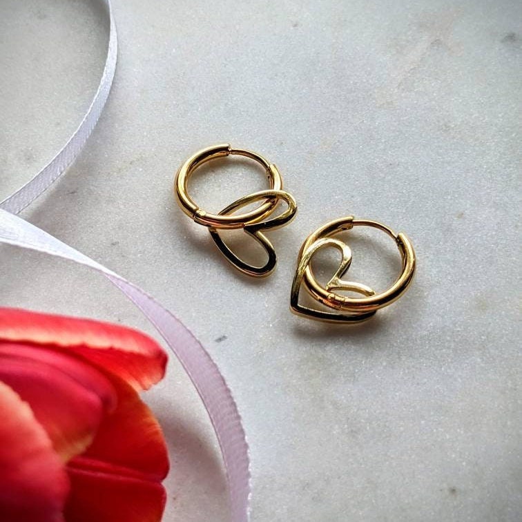 Stainless steel hoop earrings with heart pendant