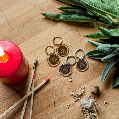 Hoop earrings with snake pendant