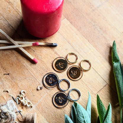 Hoop earrings with snake pendant