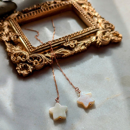 Rose gold thread earrings with mother-of-pearl stars