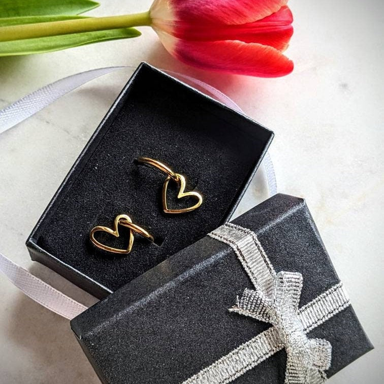 Stainless steel hoop earrings with heart pendant