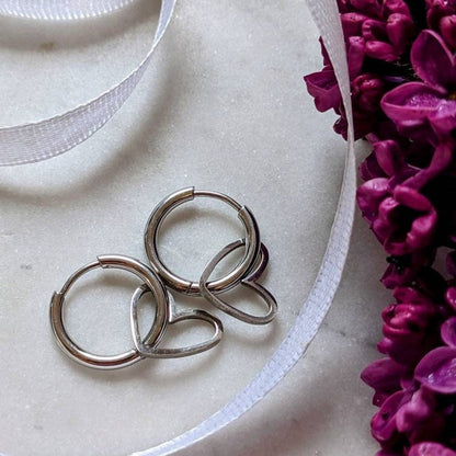 Stainless steel hoop earrings with heart pendant