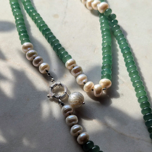 Knotted gemstone pearl necklace with hand-carved pendant