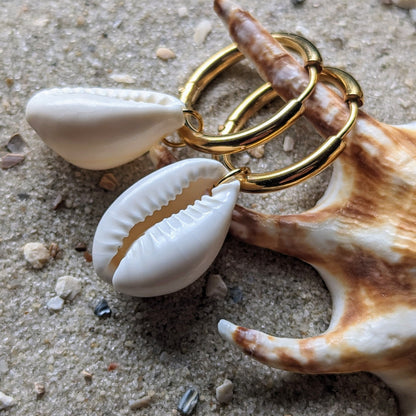 Stainless steel hoop earrings with cowrie shells