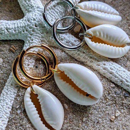 Stainless steel hoop earrings with cowrie shells