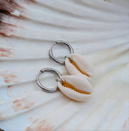 Stainless steel hoop earrings with cowrie shells
