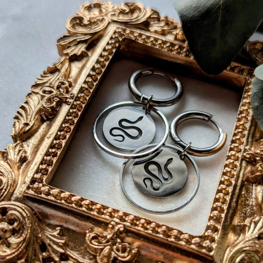 Hoop earrings with snake pendant