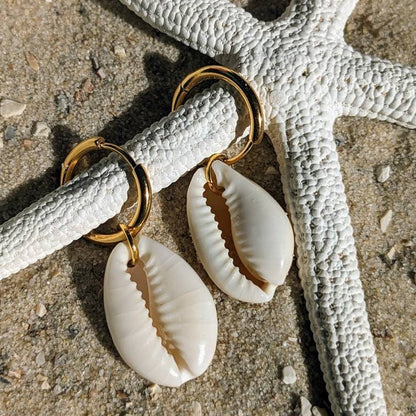 Stainless steel hoop earrings with cowrie shells